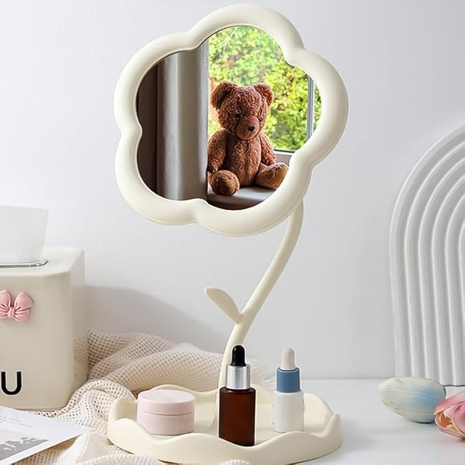 Close-up of flower-shaped frame around the clear reflective mirror surface