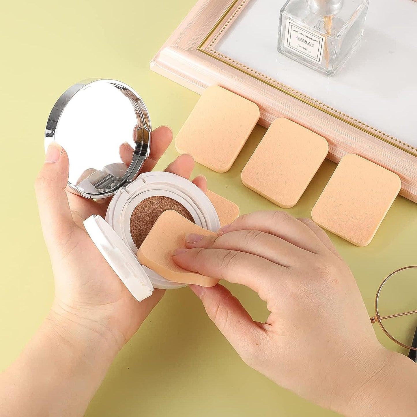 Ergonomically designed makeup sponges in different colors for blending and contouring.