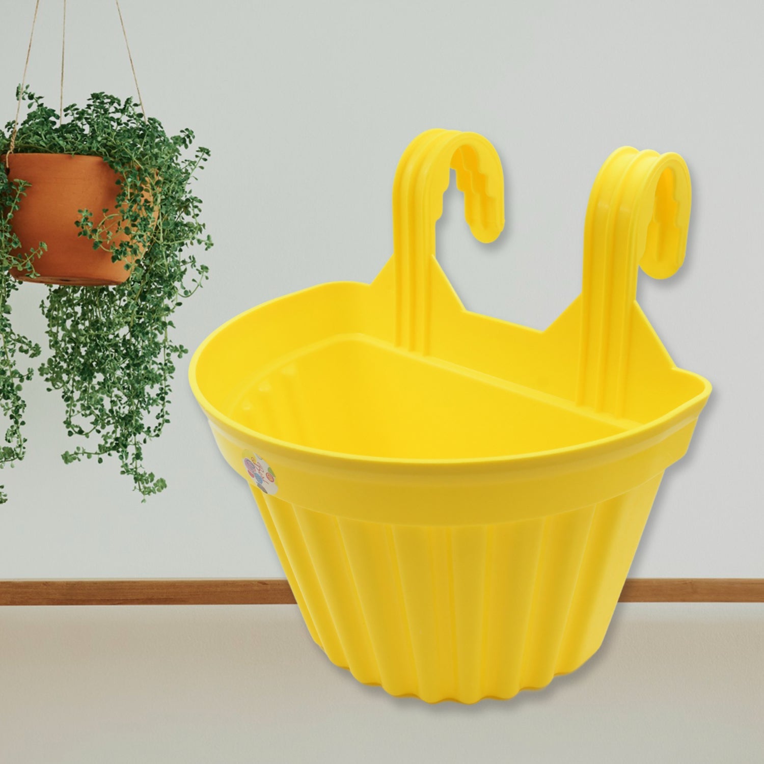 Assortment of colorful hanging plastic planters showcasing design versatility.