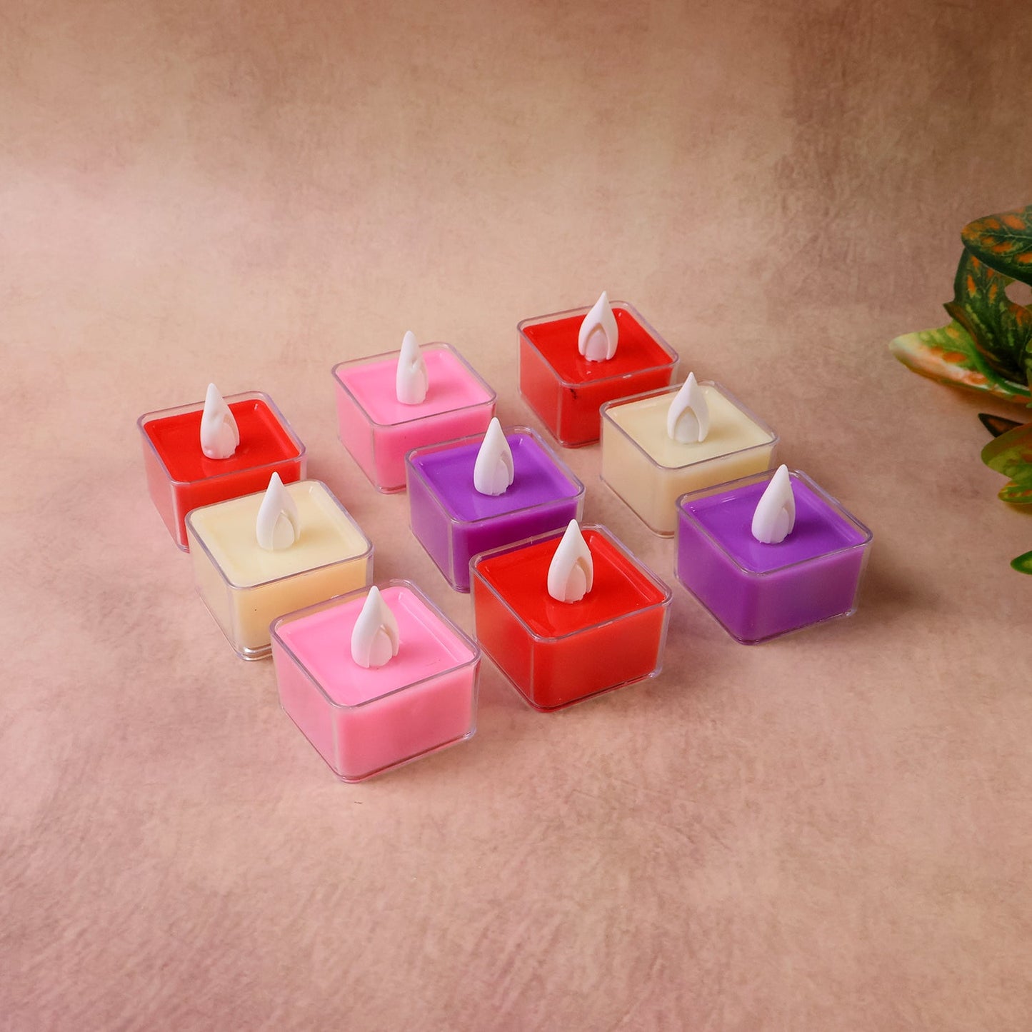 Close-up of multicolor square LED tealight candle showing flickering flame effect