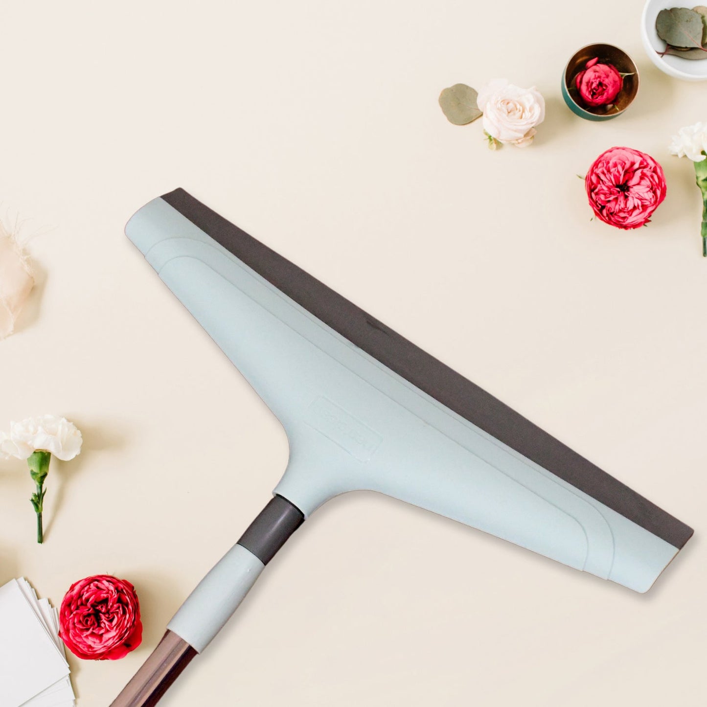 Close-up view of the 16-inch Ganesh floor wiper head and mild steel handle.