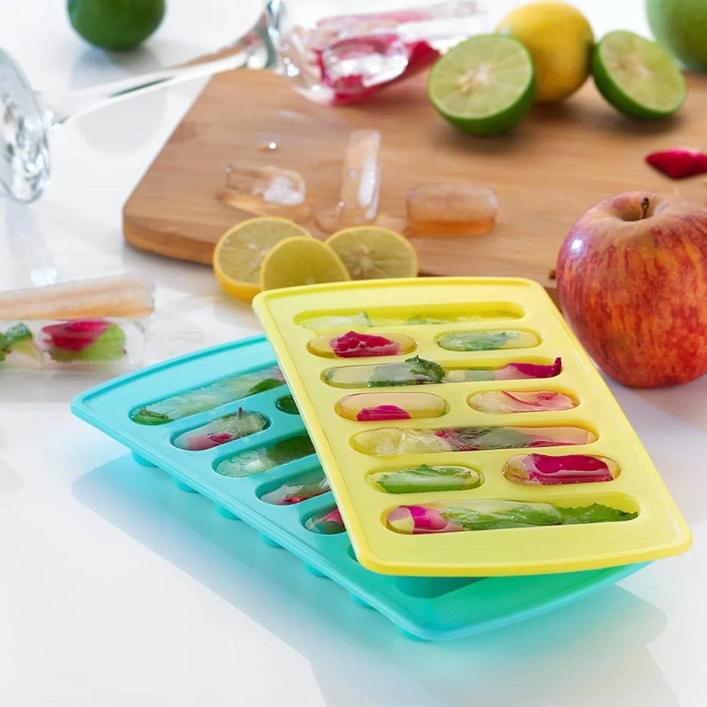 Top-down view of a blue ice tray on a modern kitchen counter, ready for filling.