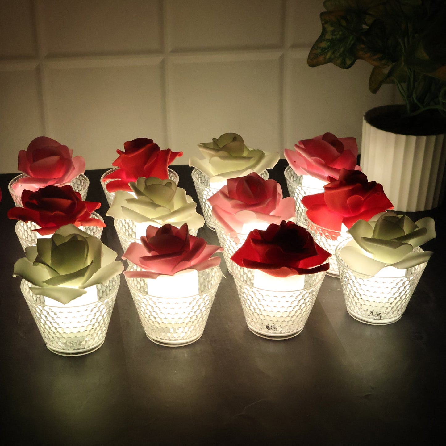 Set of Rose Shaped Flameless LED Candles glowing softly with glass holders