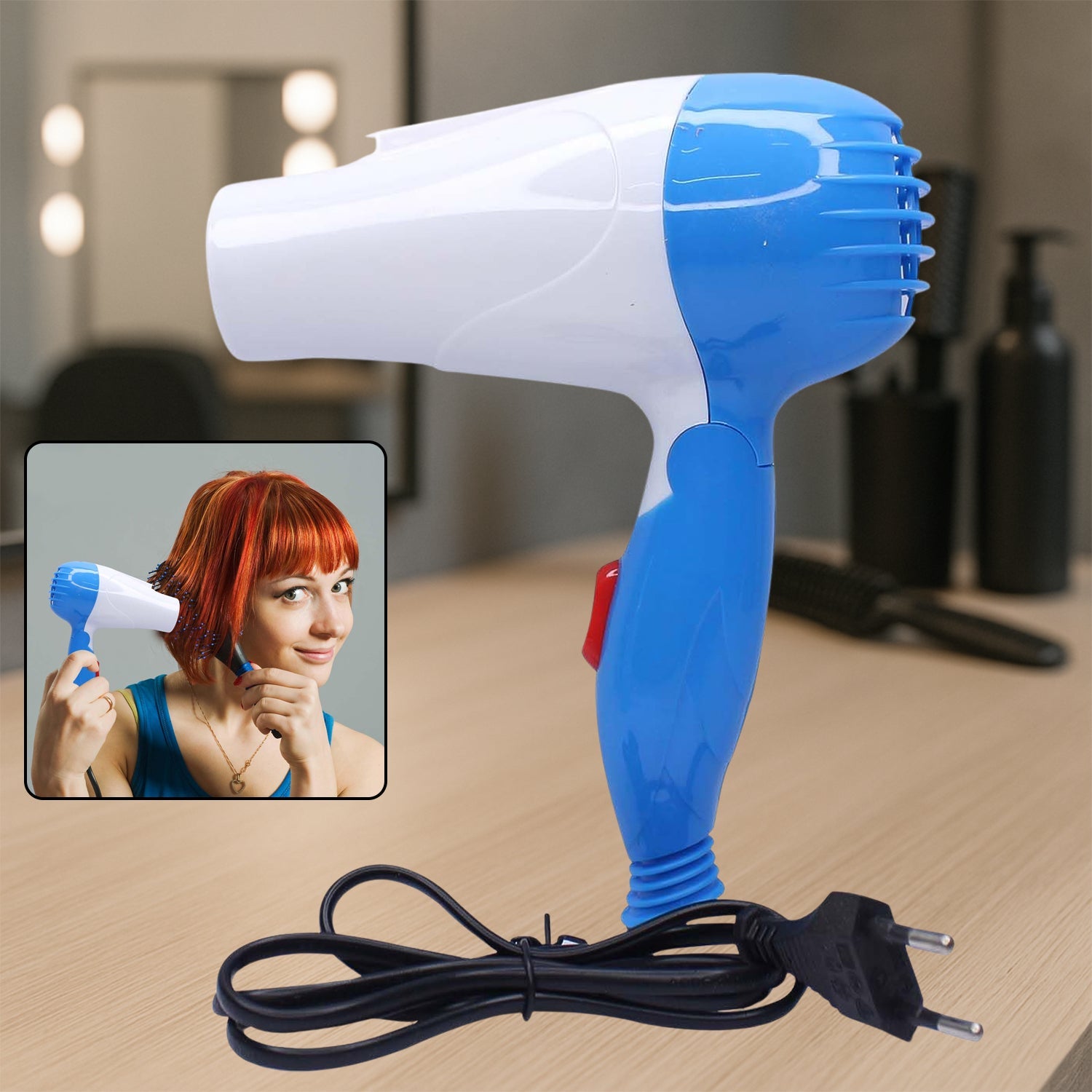 A compact folding hair dryer with its cord neatly coiled.