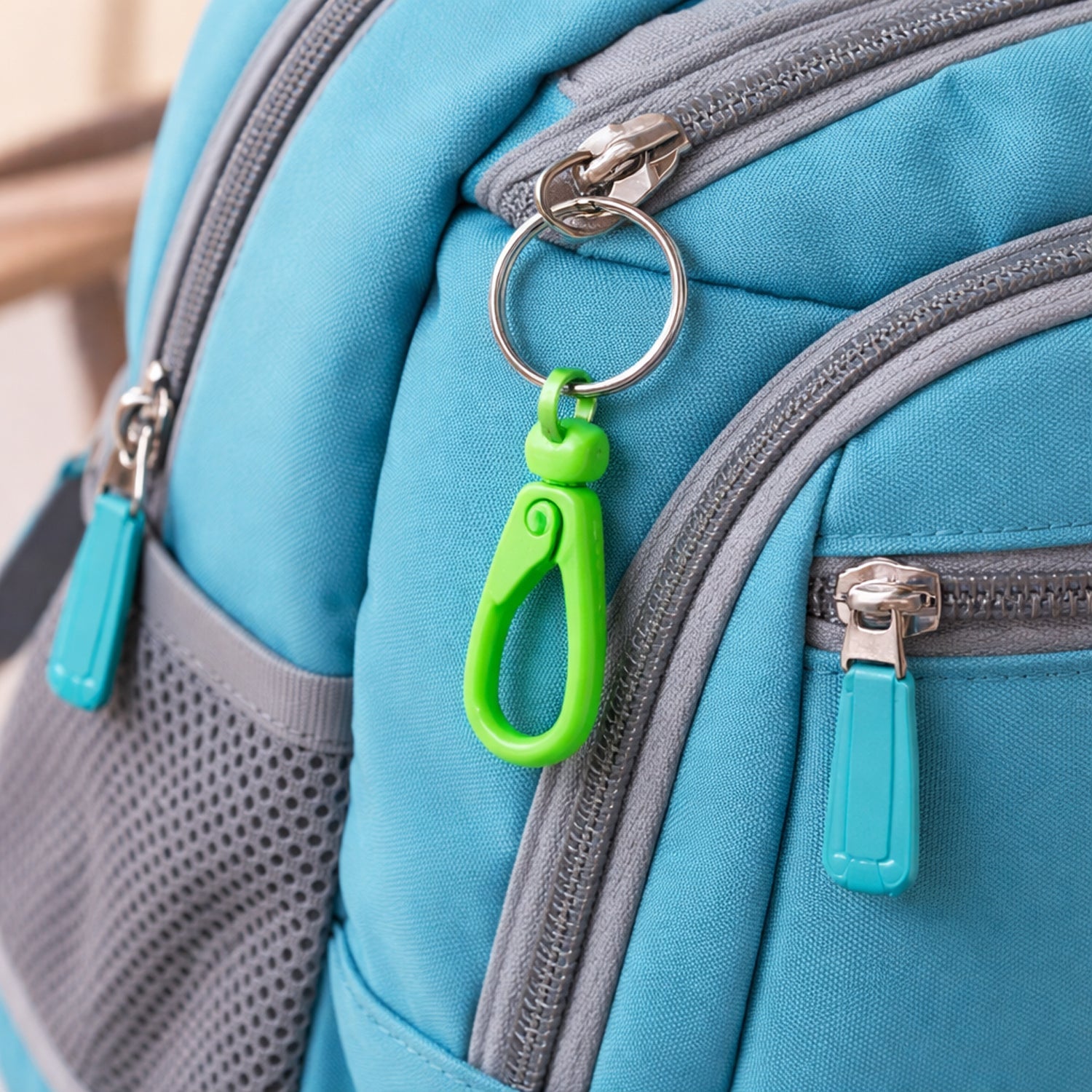 Close-up of plastic carabiner clip showing sturdy locking mechanism