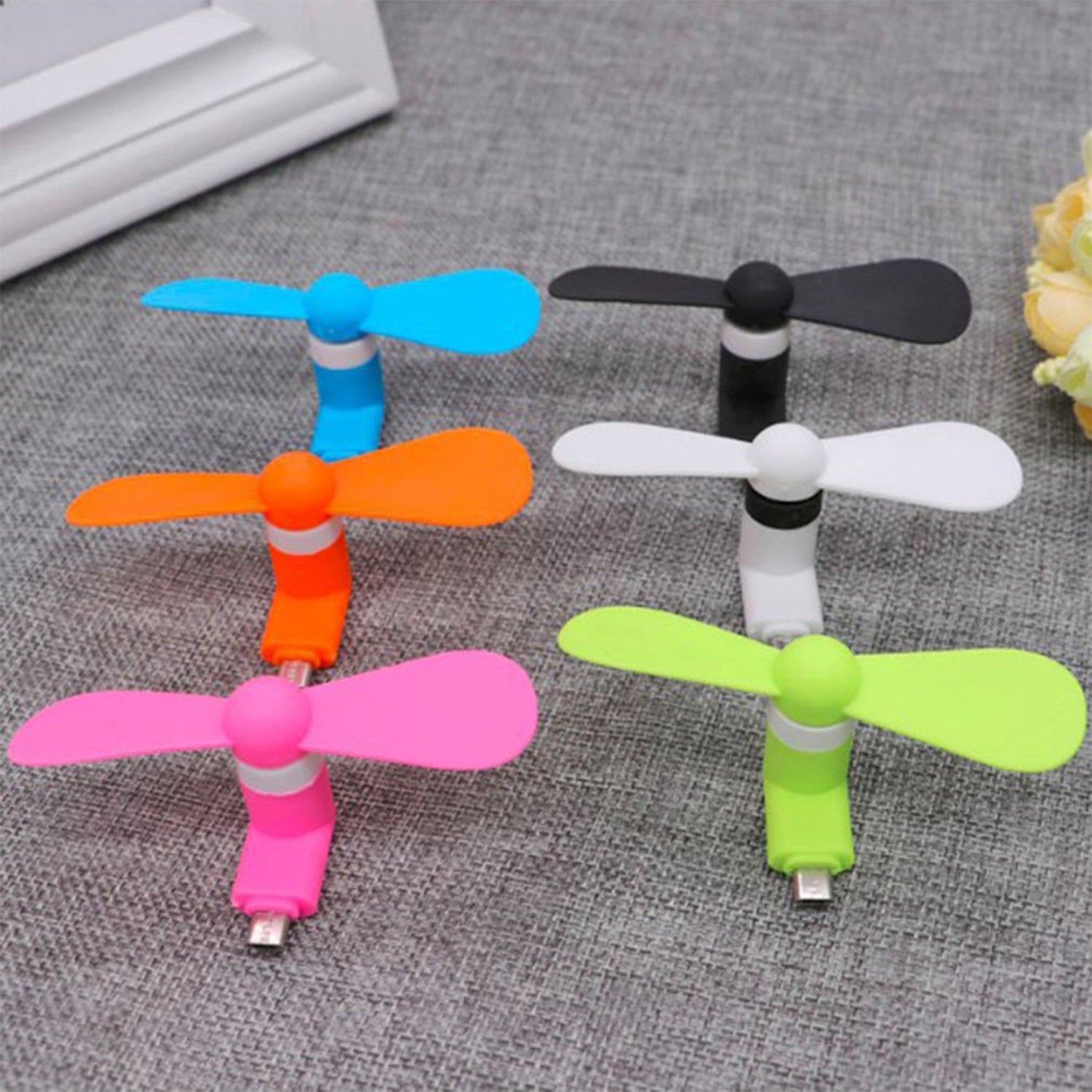 USB fan for personal cooling, shown with its simple design.