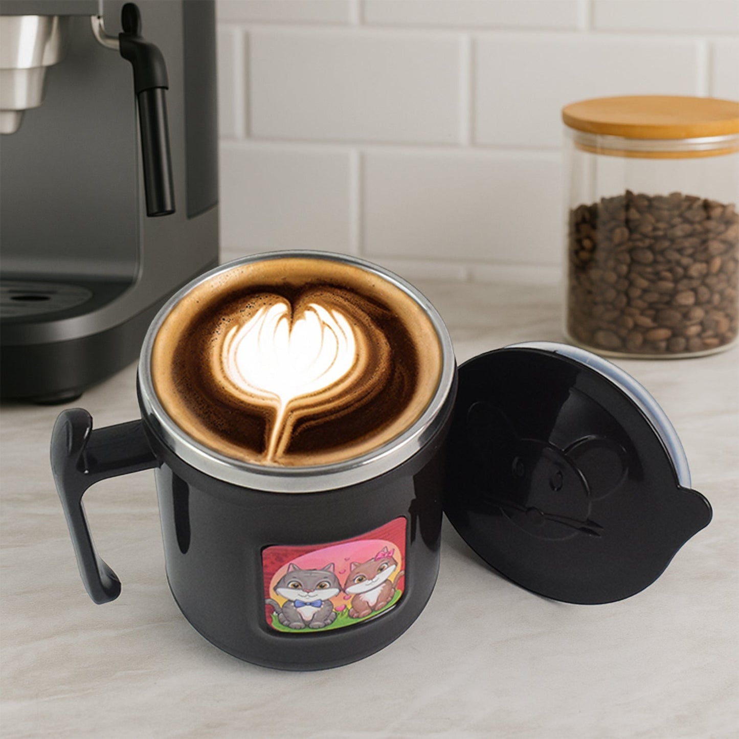 Insulated cat mug showing its dimensions with a measuring tape.