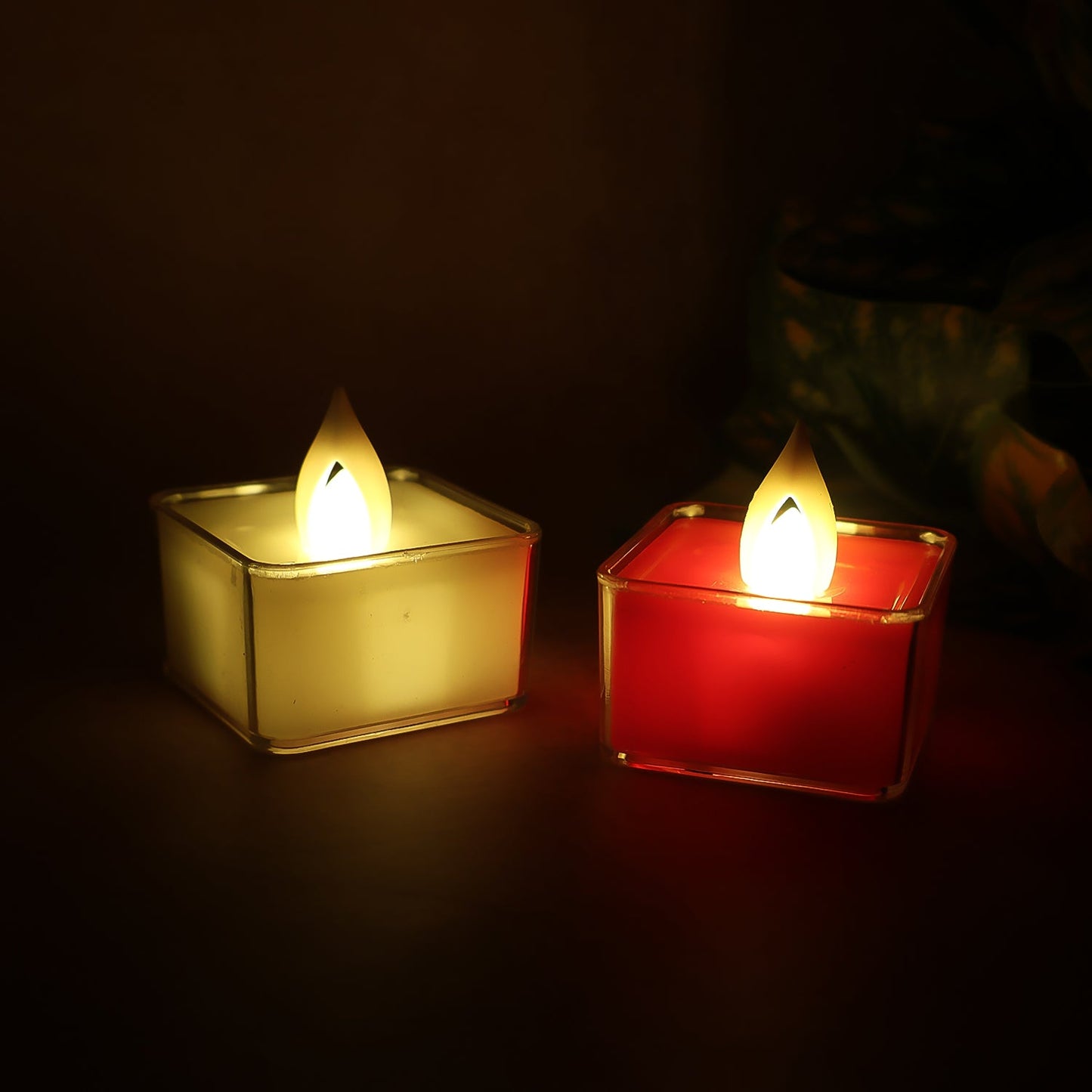 Set of nine square LED flameless tealight candles arranged on a table