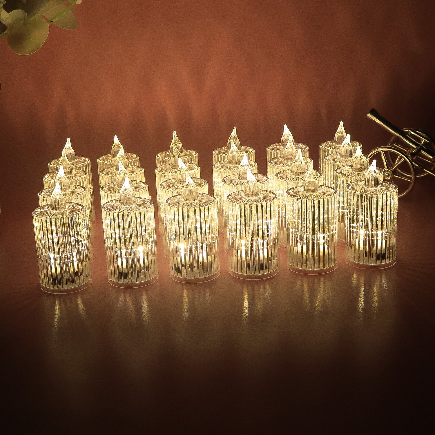 Multiple LED flameless decorative candles arranged showing crystal pattern and warm glow