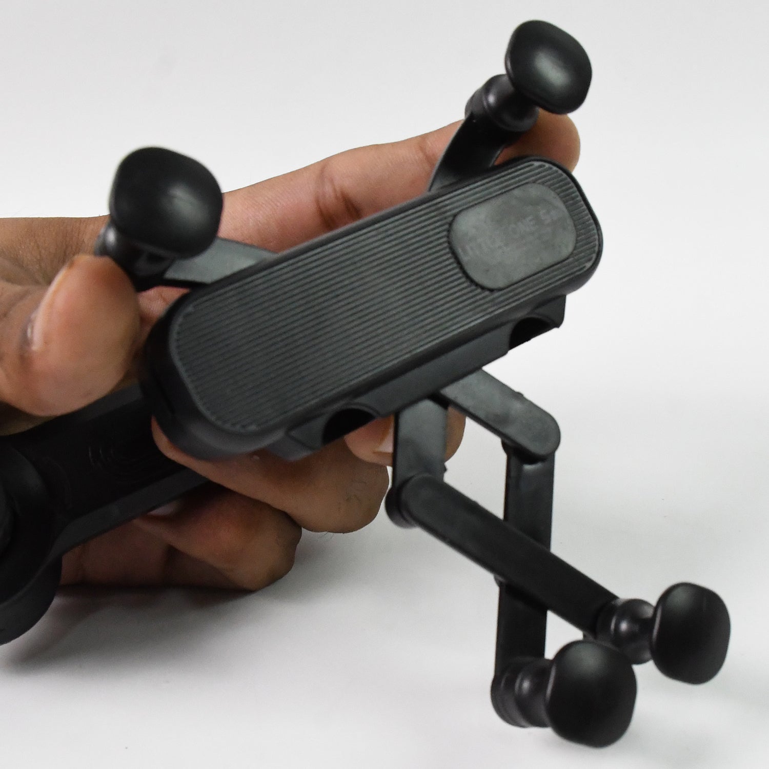 Car phone holder demonstrating its 360-degree rotation capability for optimal viewing angles.