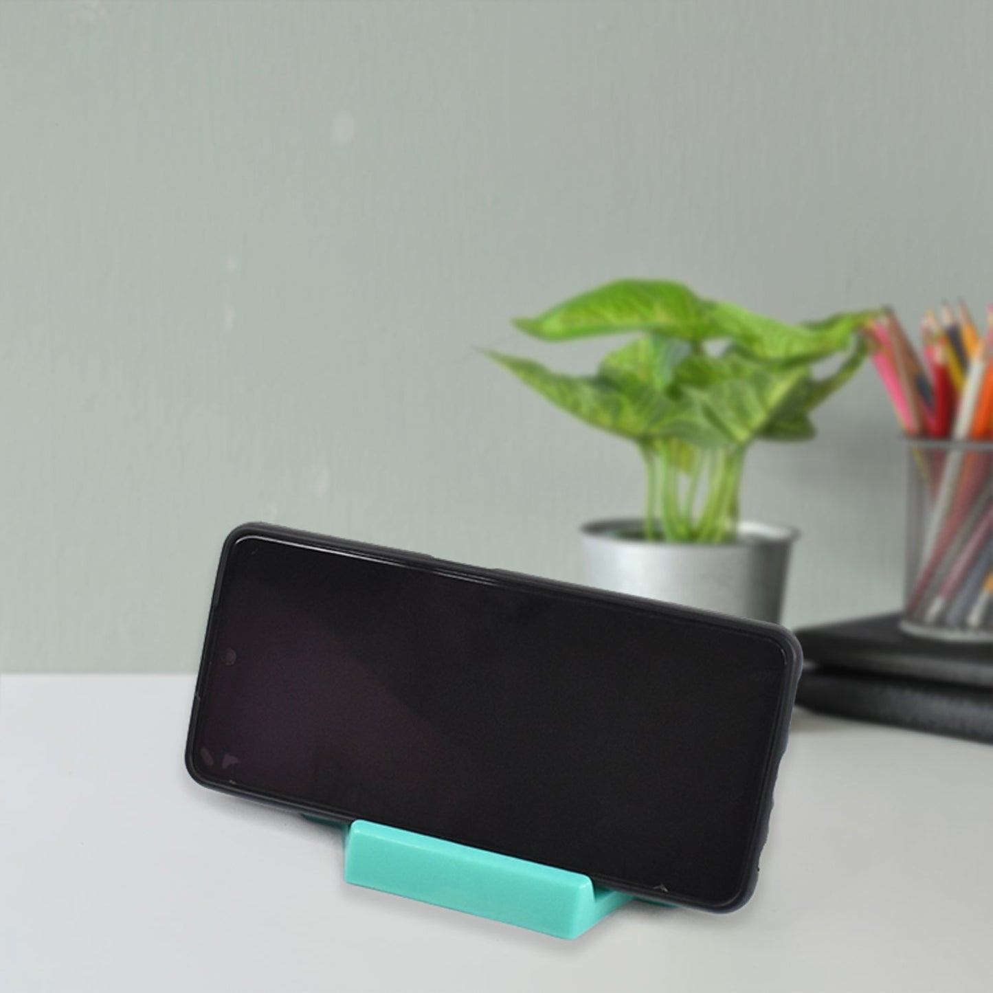 Rectangular slot of mobile holder to fix charging cable
