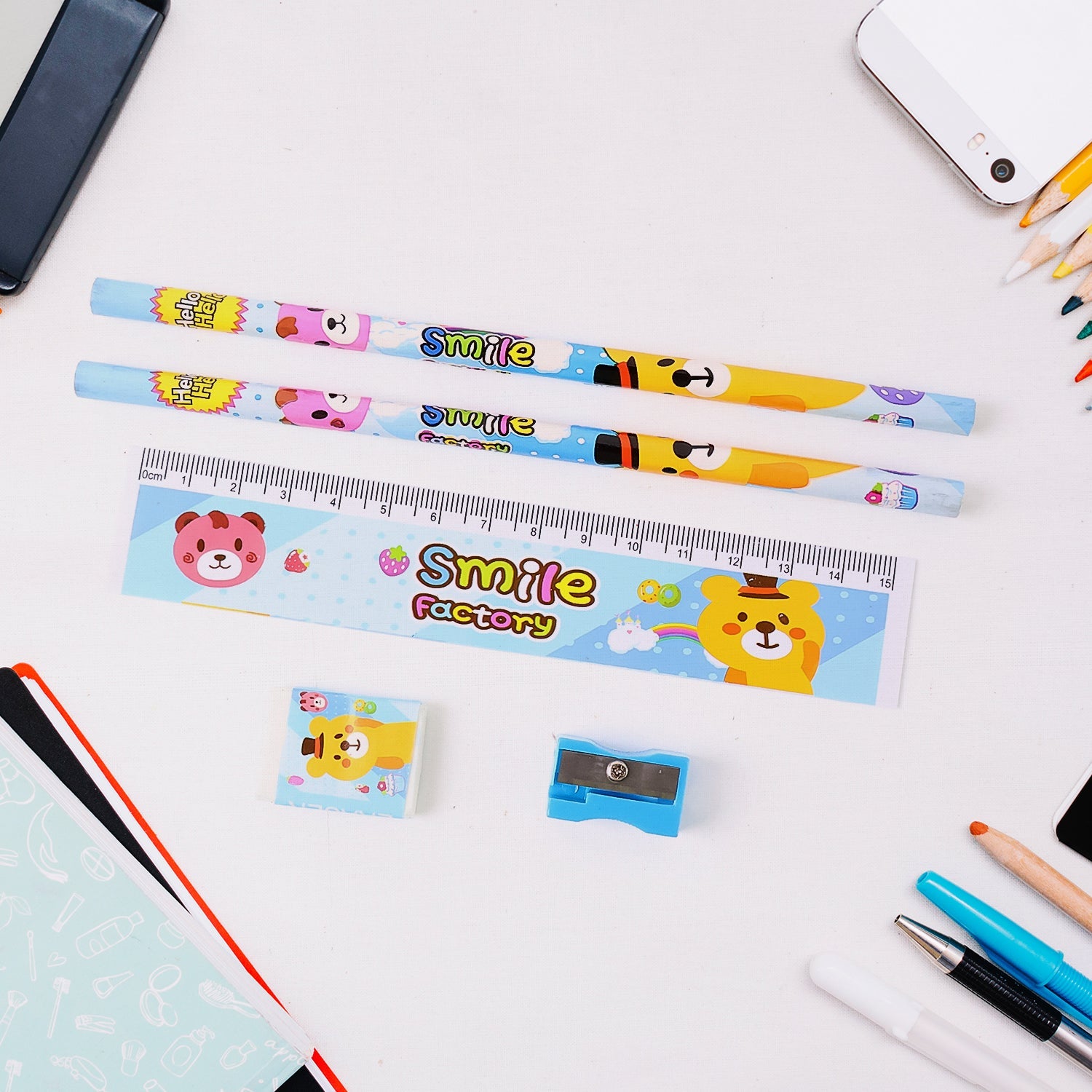 Wooden sharpener and ruler with cute animal-themed designs.