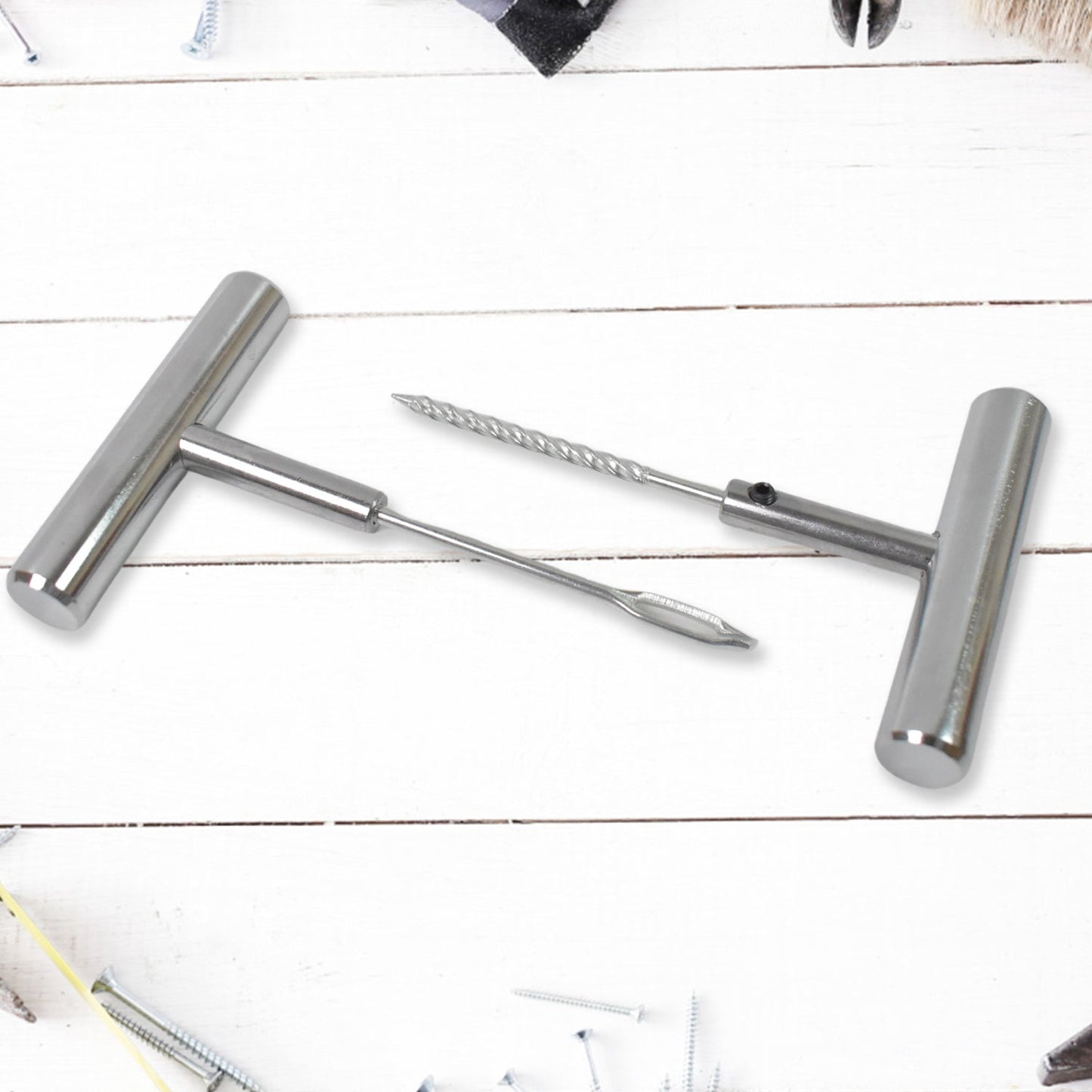 Tyre repair kit tools shown in hand for scale and easy handling.