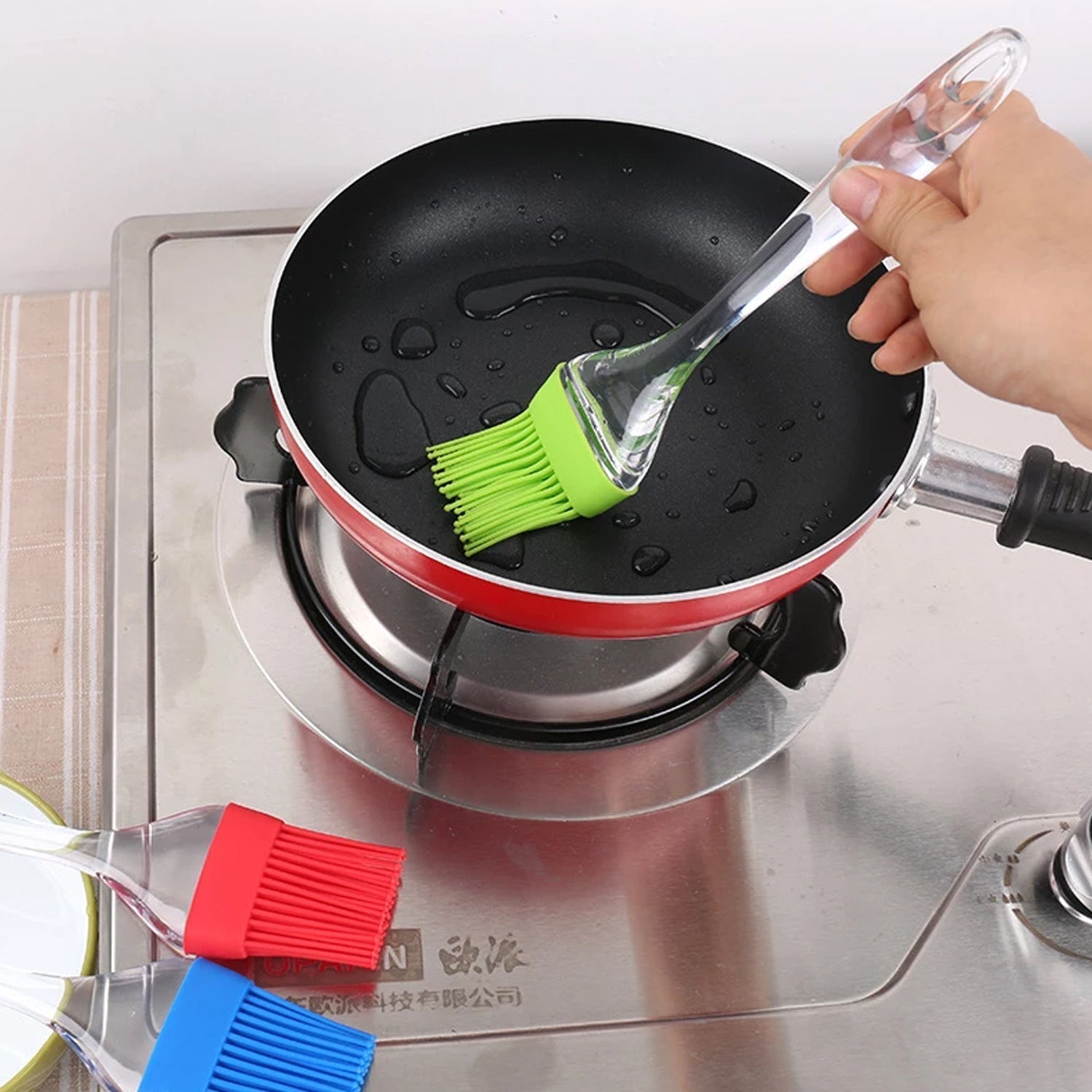 Silicone pastry brush and spatula, safe for non-stick surfaces.