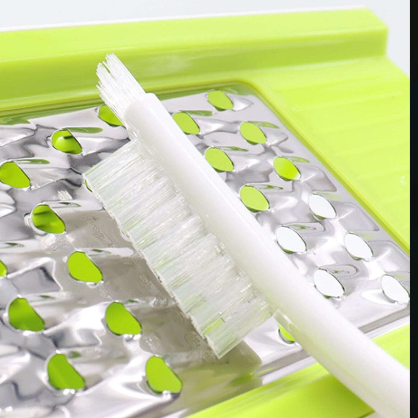Kitchen cleaning brush with white handle and bristles
