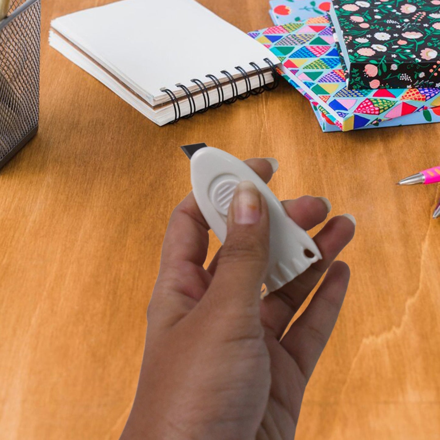 Mini Cloud Box Cutter held in hand for size reference