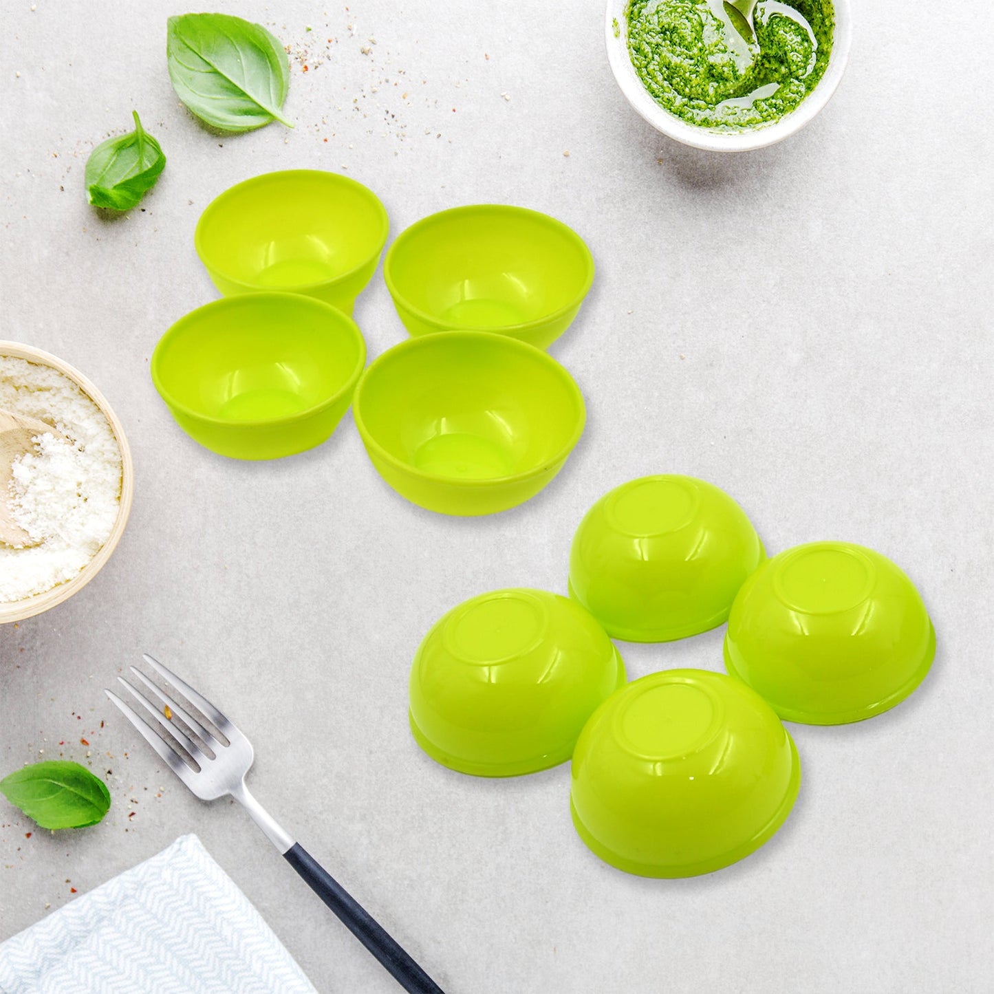 Compactly stacked plastic bowls, demonstrating space-saving storage.