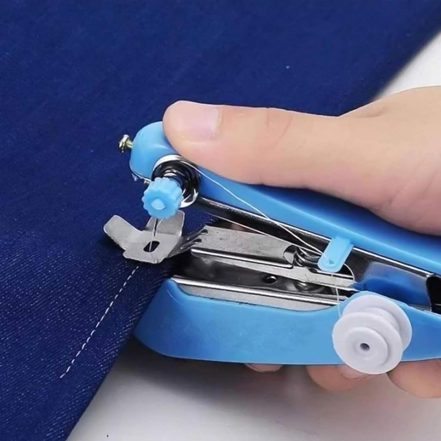 Comparison of the compact handheld sewing machine with a larger traditional model.