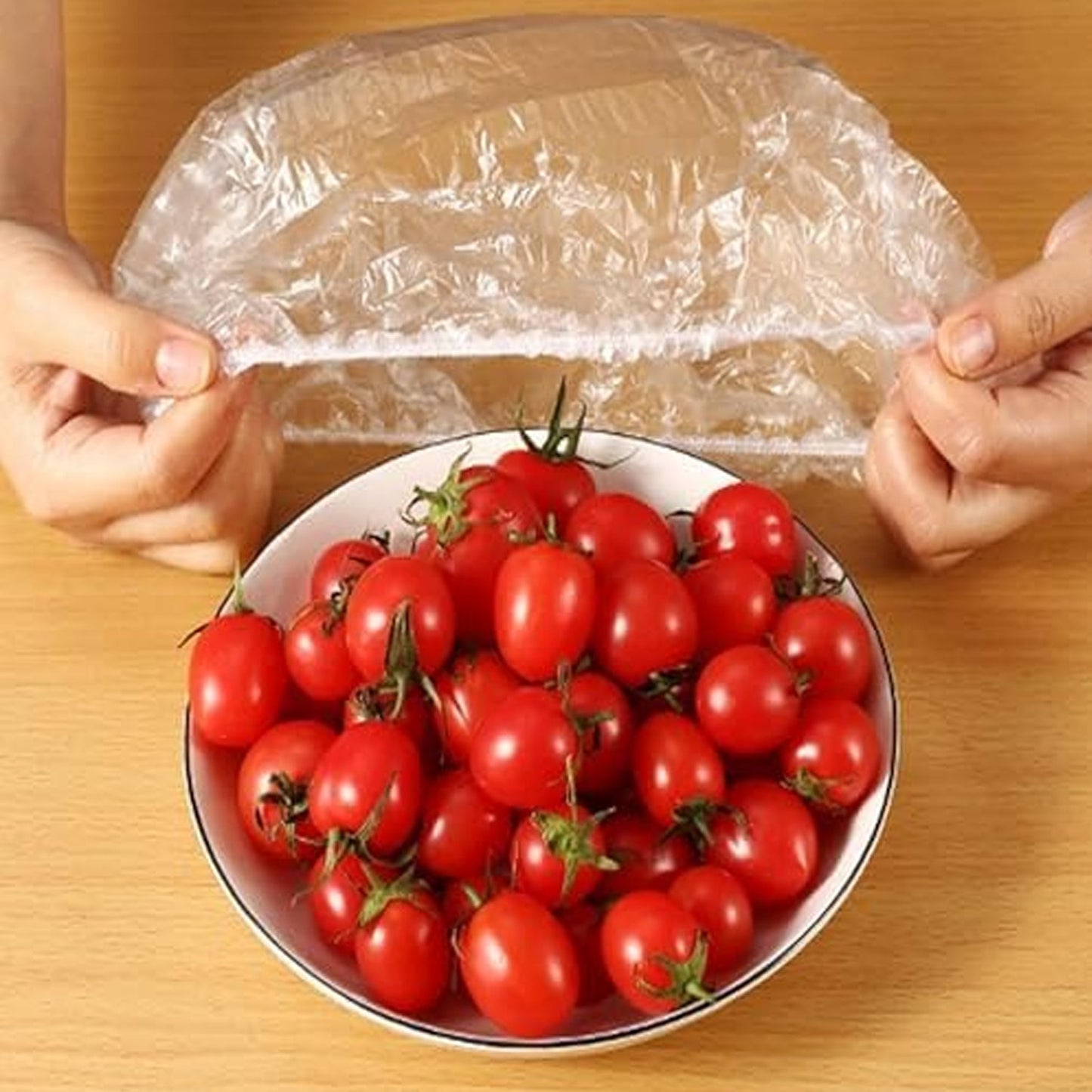 Flexible elastic food cover adapting to a rectangular food container for secure storage.