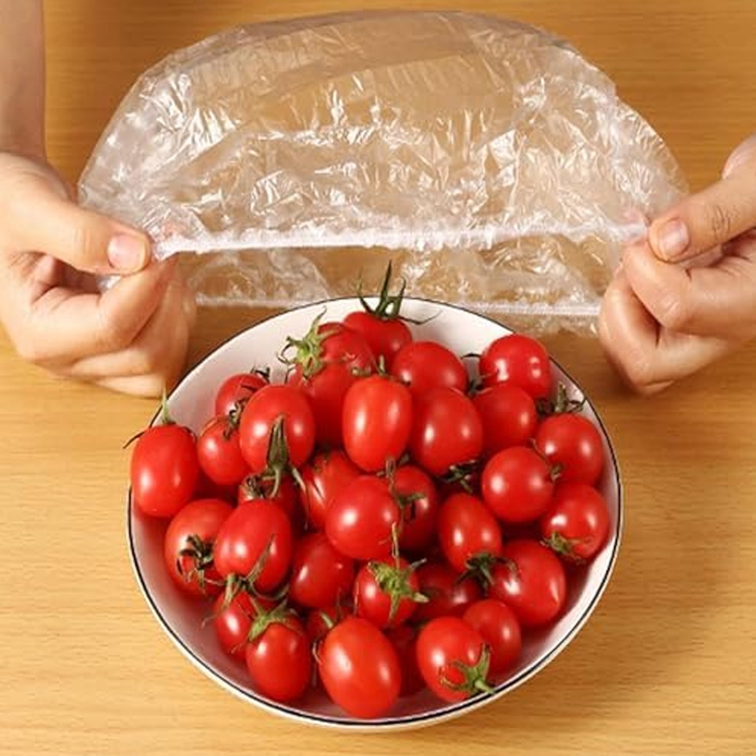 Flexible elastic food cover adapting to a rectangular food container for secure storage.