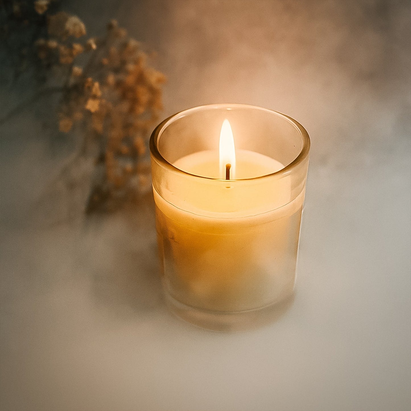 The Scented Votive Candle illuminating a cozy living space, enhancing home fragrance.
