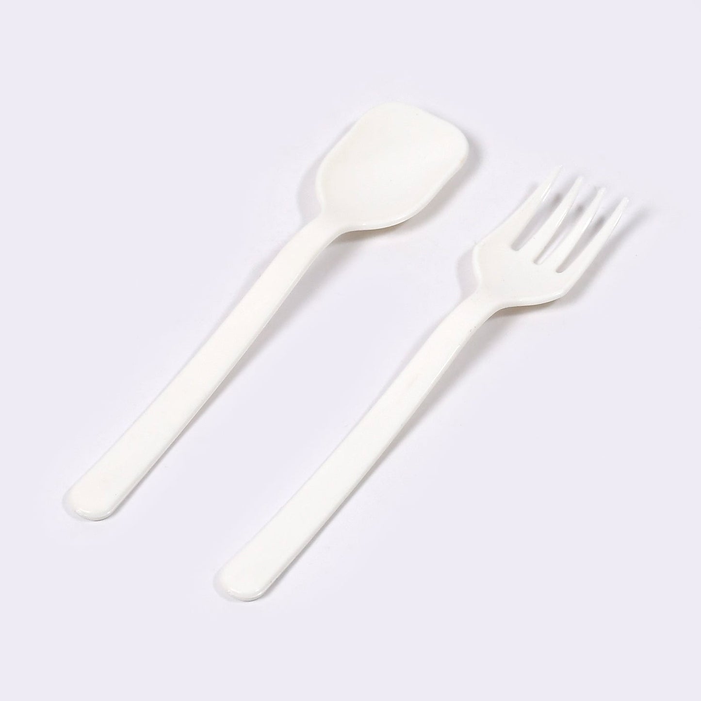 Two pieces of Quickslice heavy-duty plastic cutlery, a fork and a spoon, ready for use.