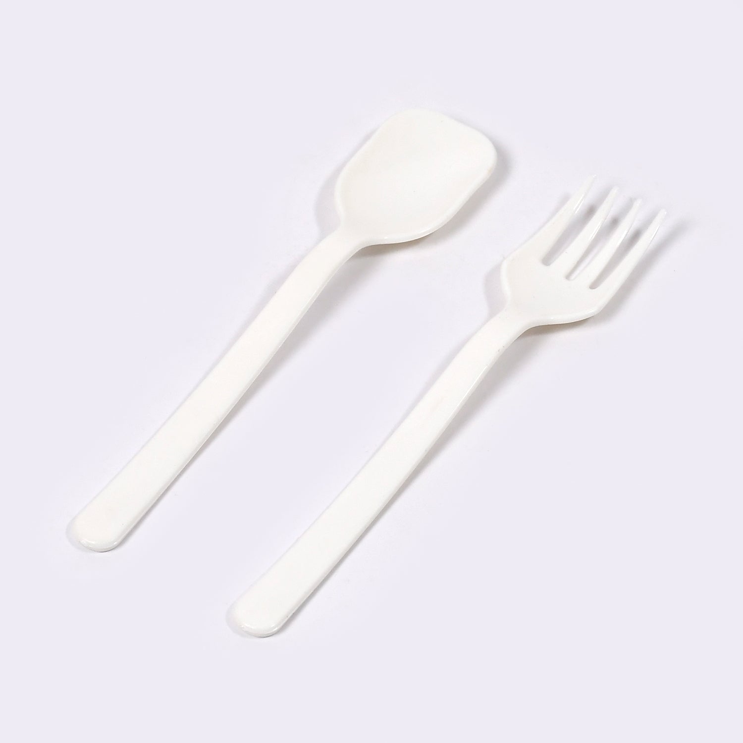 Two pieces of Quickslice heavy-duty plastic cutlery, a fork and a spoon, ready for use.