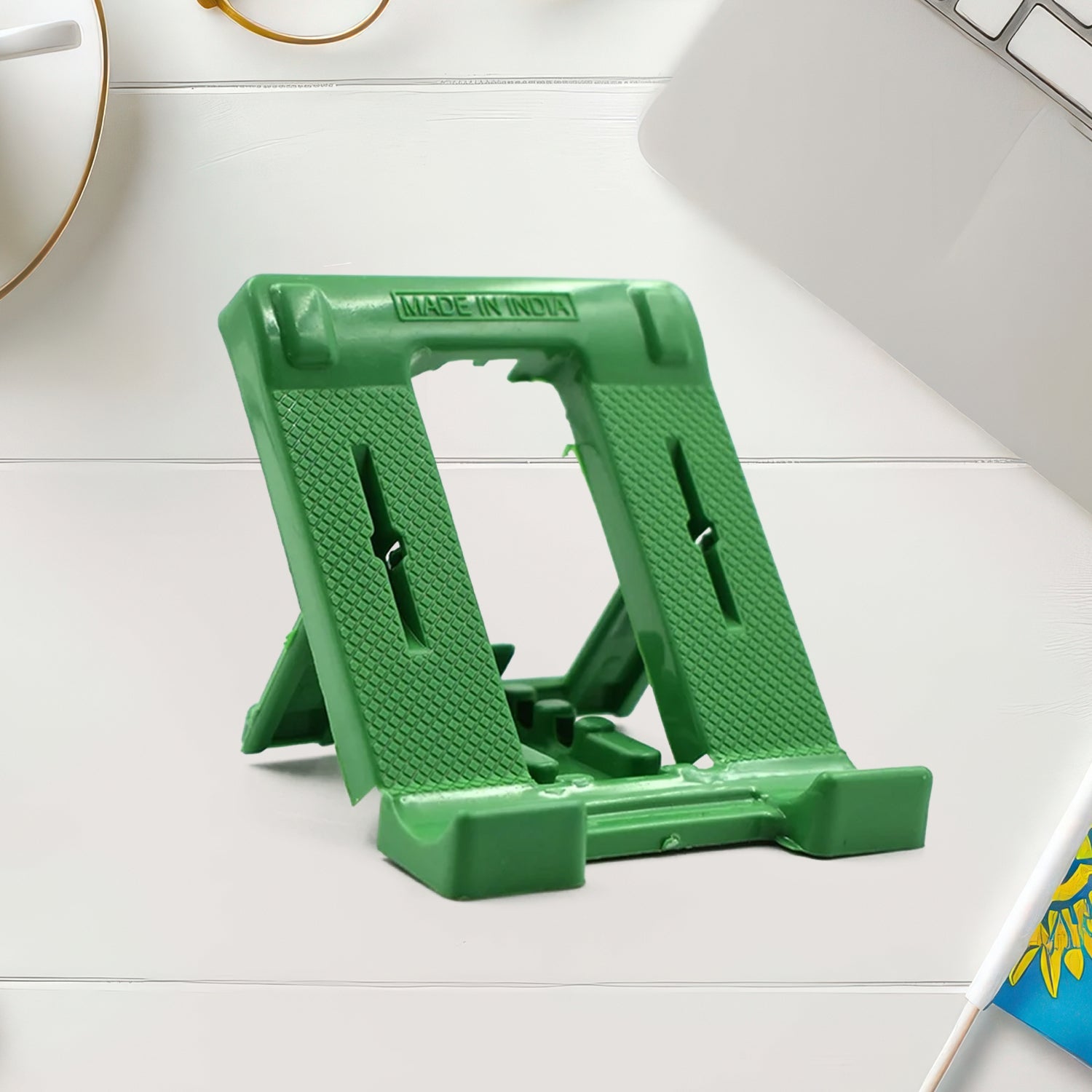 Foldable phone stand holding smartphone horizontally with adjustable angle