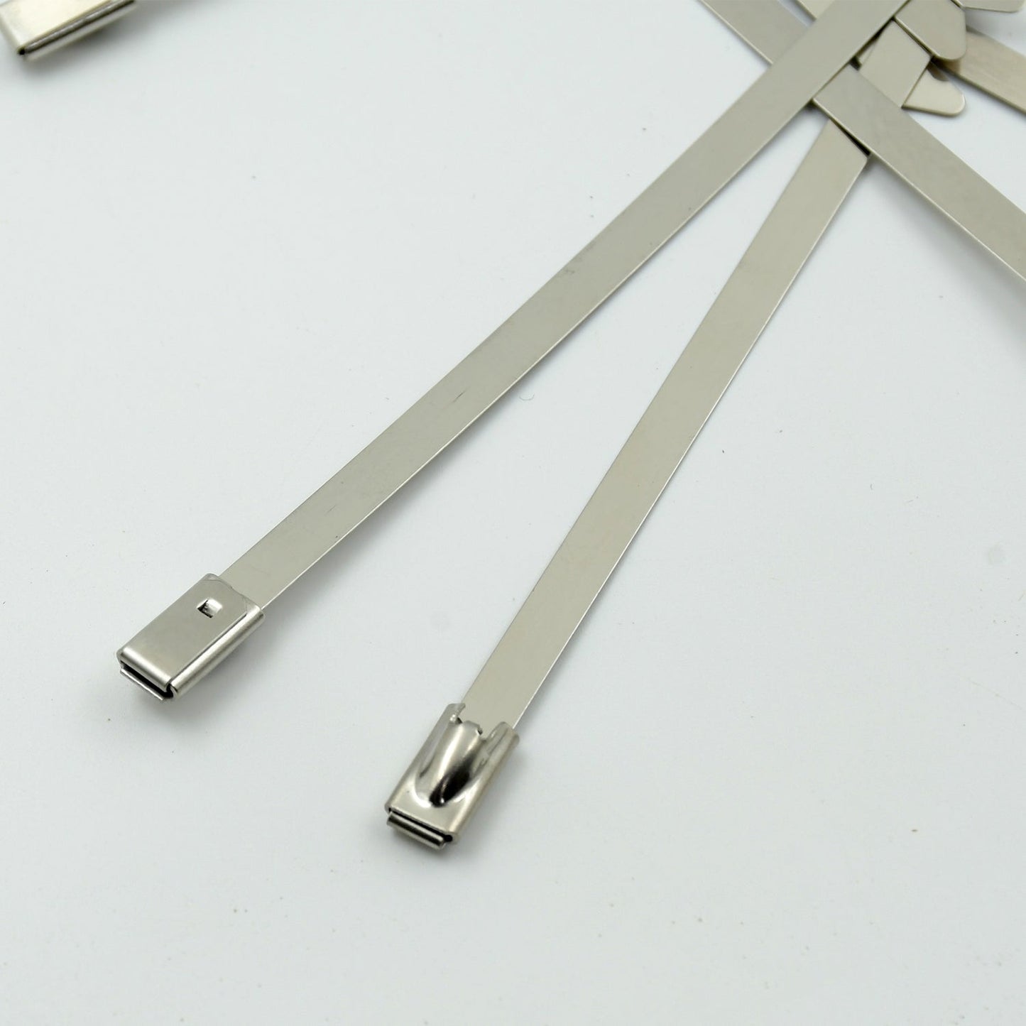 WipeTech's corrosion-resistant stainless steel cable fasteners against a metallic background.
