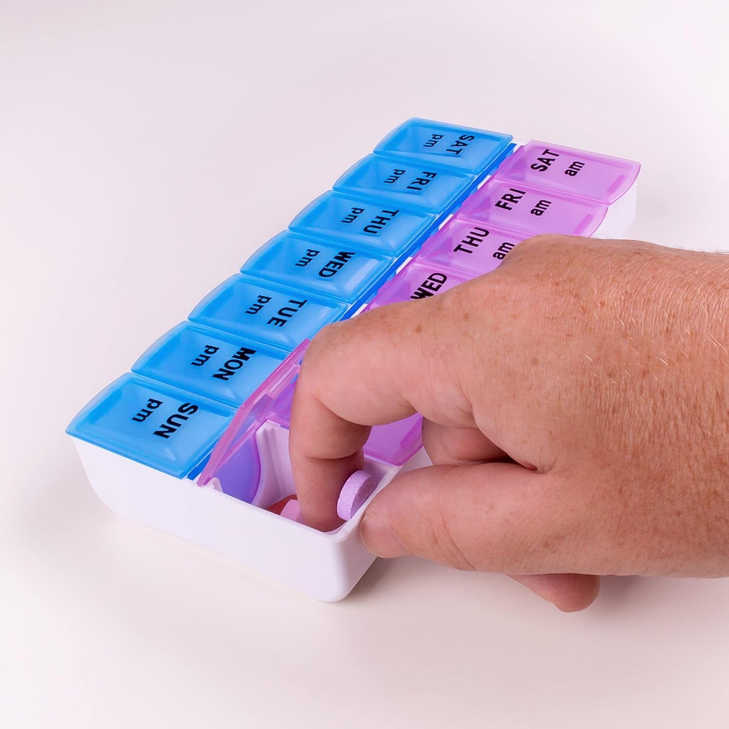 Side view of BPA-free plastic weekly medicine pill organizer