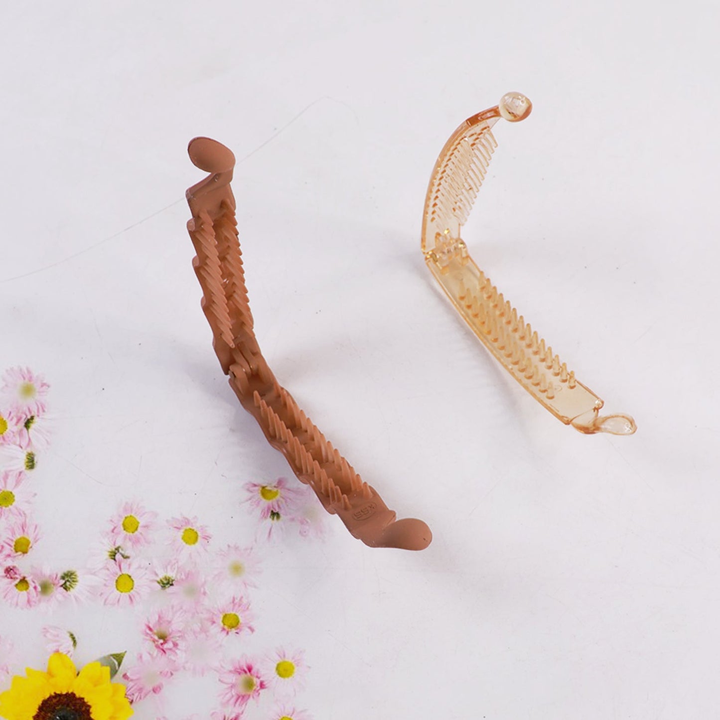 Plastic claw hair clip designed to hold hair firmly and stylishly