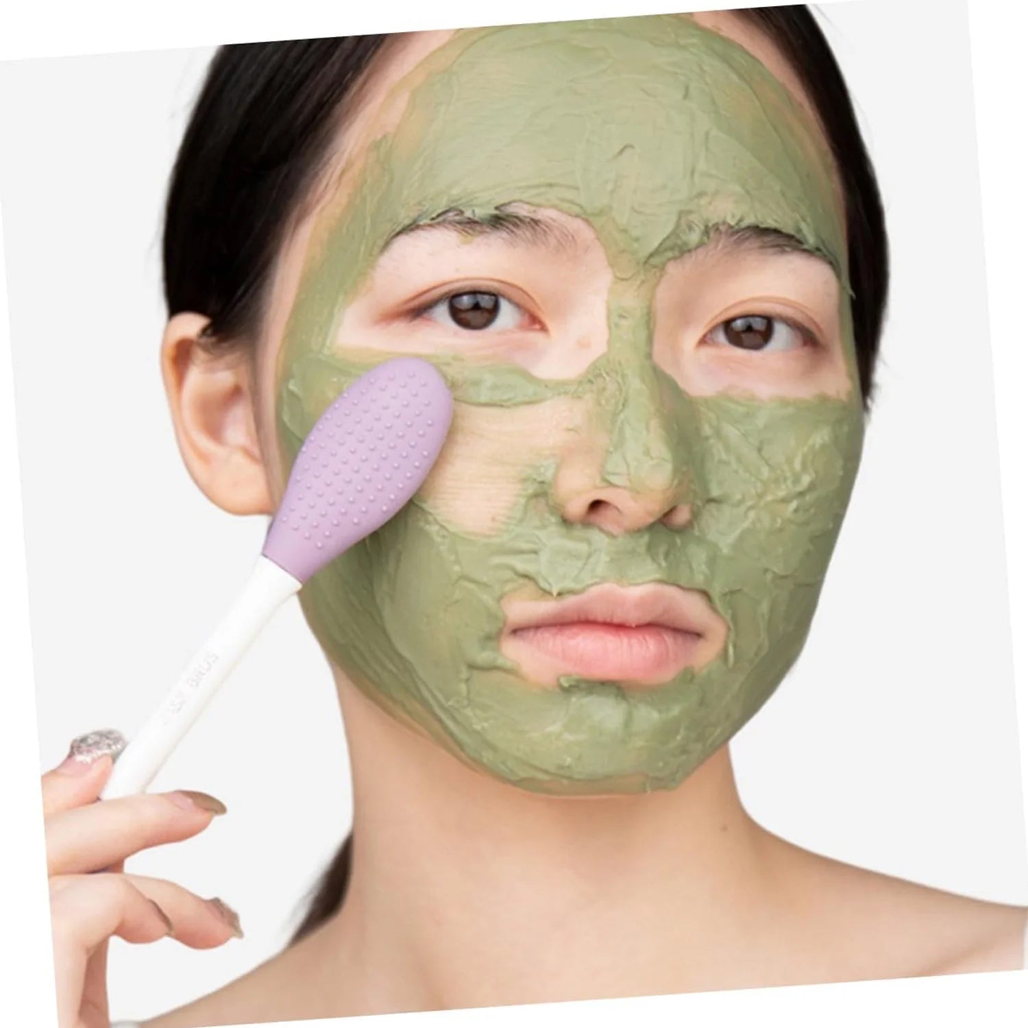 Side view of the versatile silicone mask brush, showcasing its compact design.