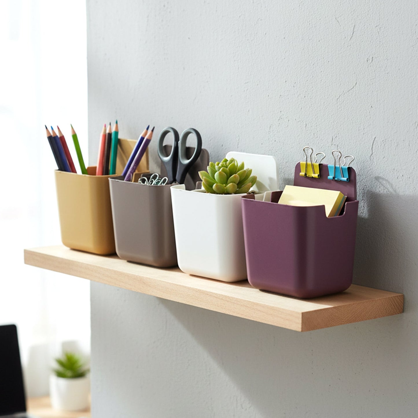 A versatile plastic holder stand securely mounted on a tiled bathroom wall.