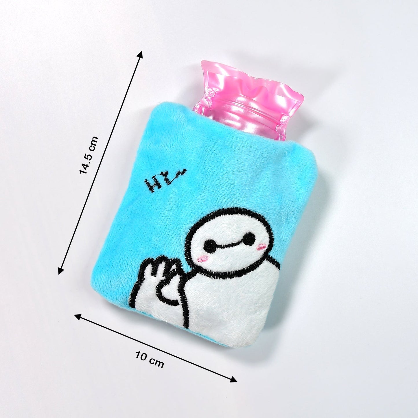 The natural rubber hot water bag removed from its blue Baymax cover.
