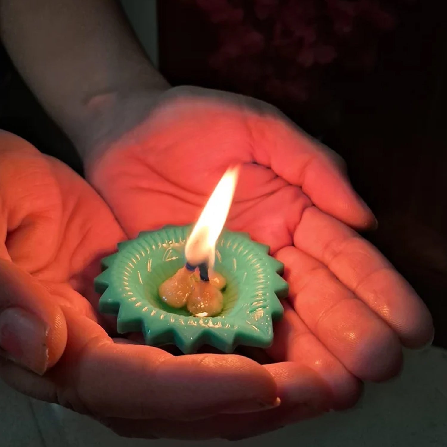 A pair of decorative silicone diyas emitting a soft glow, perfect for creating a spiritual atmosphere.