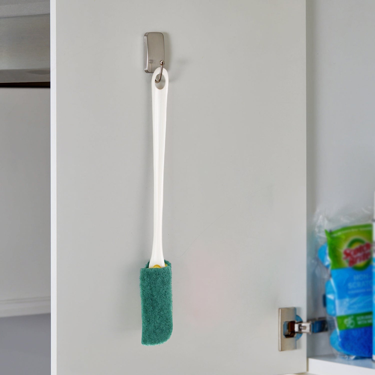 Long ergonomic handle with hanging hole featured on the bottle brush