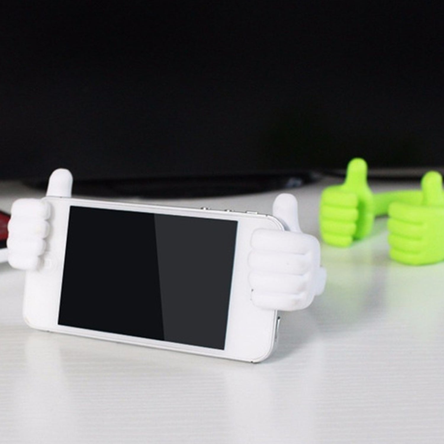 Side view of the hand-shaped mobile stand holding a phone, demonstrating its stable angle.