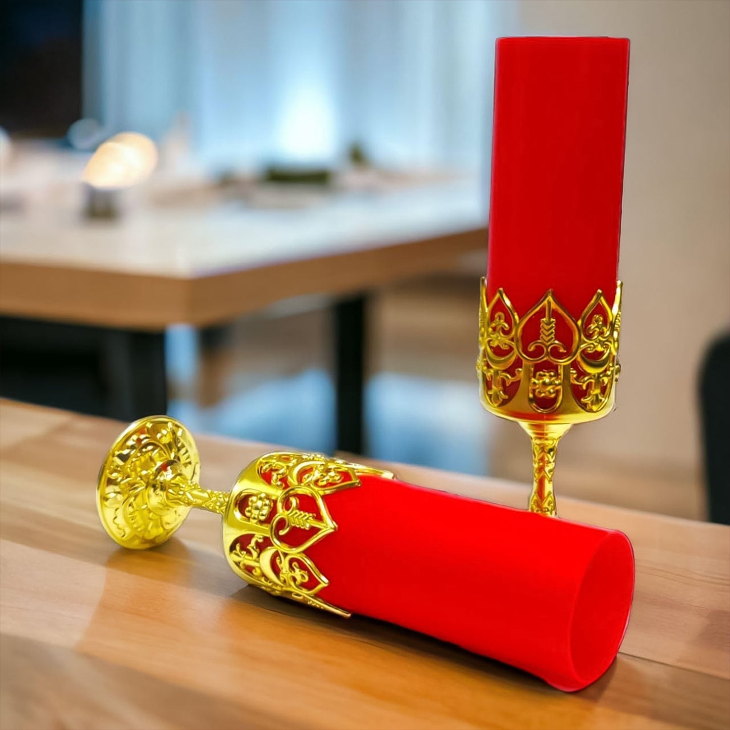 Warm glowing LED candle light on decorative golden stand