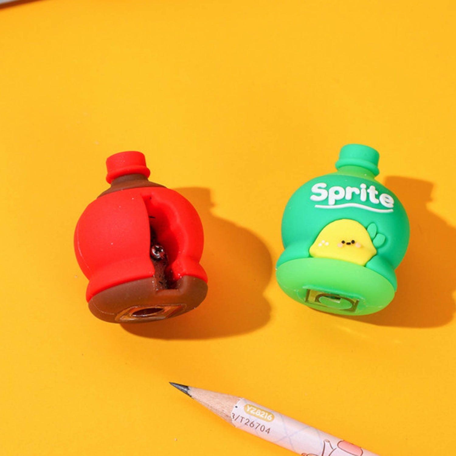 A 3D cold drink bottle shape pencil sharpener and eraser set for kids.