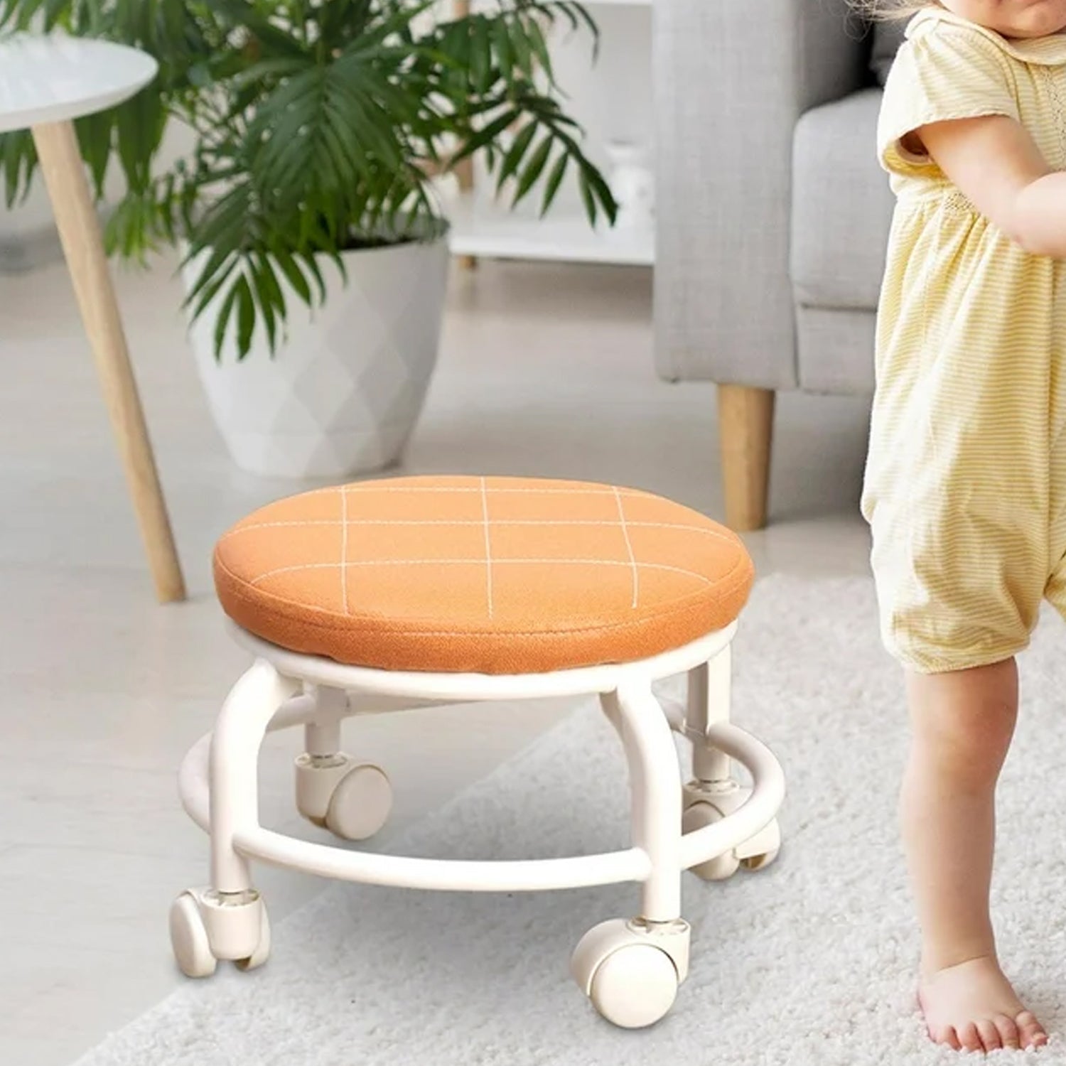 Compact white rolling stool with 360-degree swivel wheels.