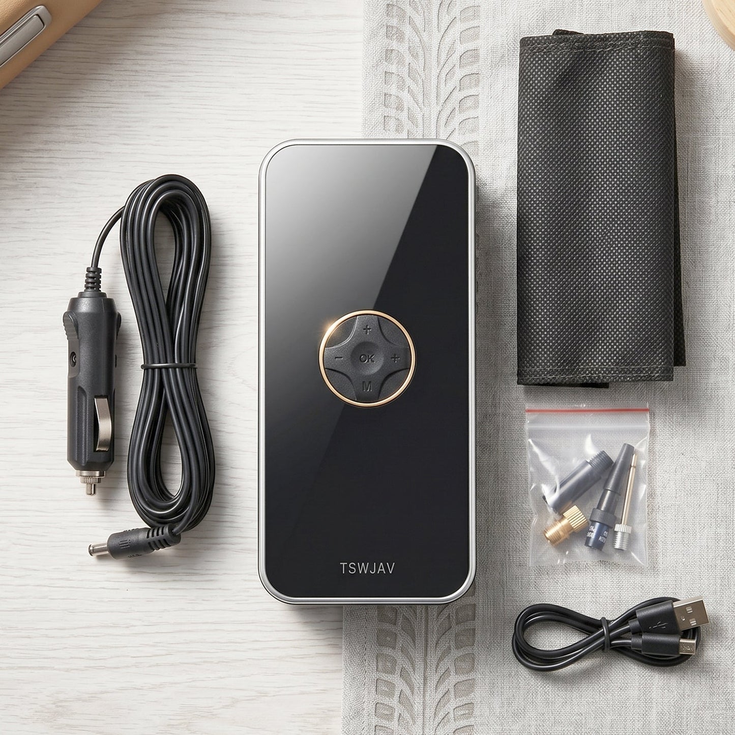 Portable air pump with charger cables, nozzles, and storage pouch