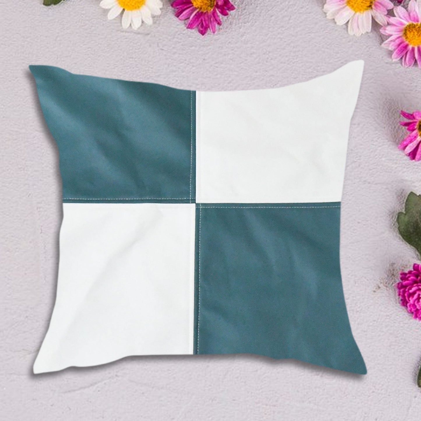 Soft decorative pillow cover in a light colour on a modern living room sofa.