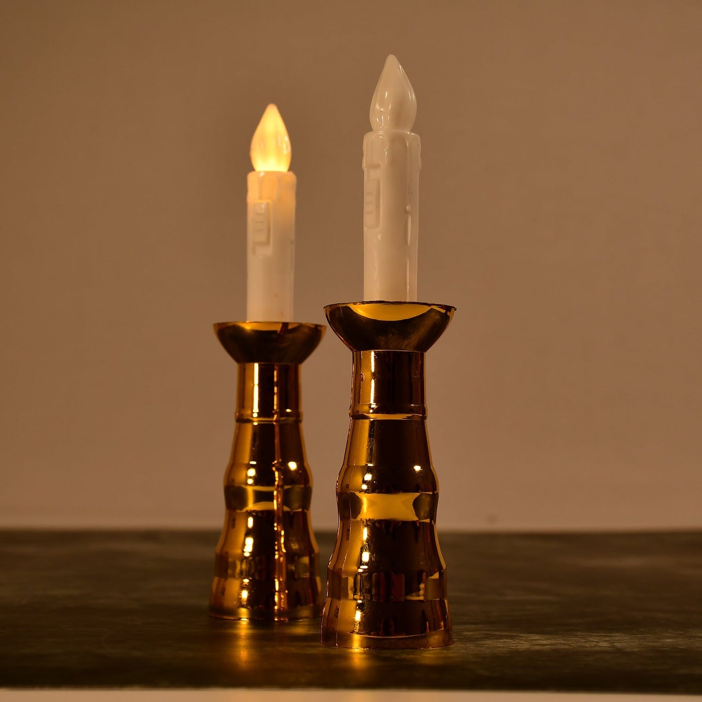 A pair of decorative flameless LED candle lights creating a warm ambiance.
