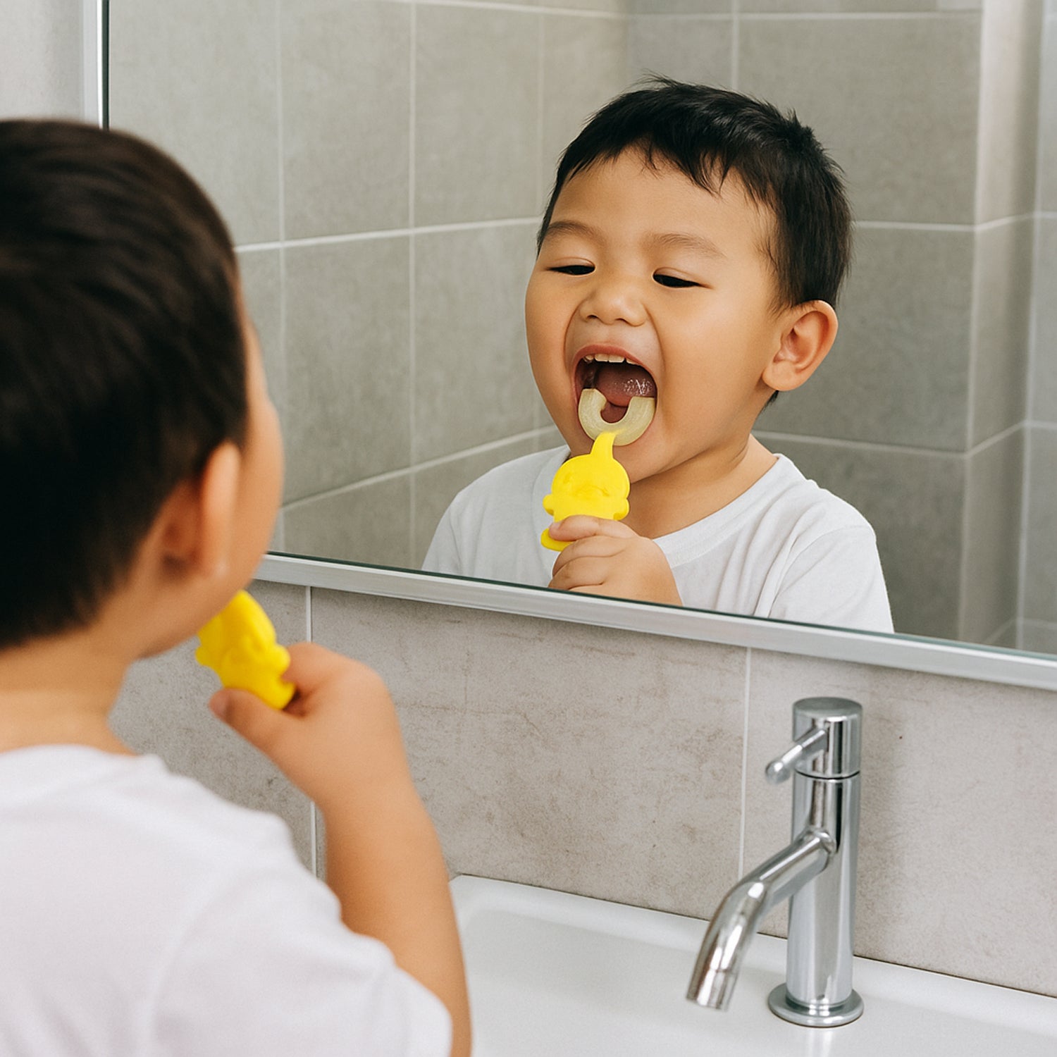 Baby toothbrush featuring easy-grip duck handle for toddlers