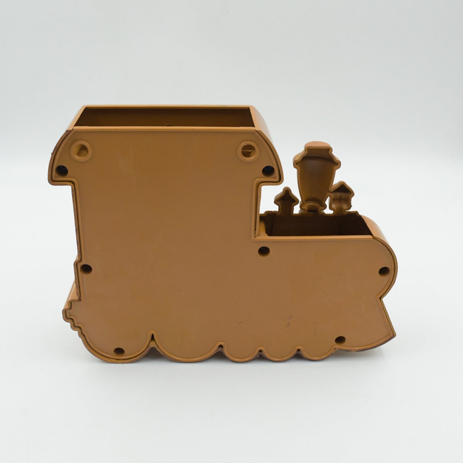 Front view of the brown plastic train key holder.