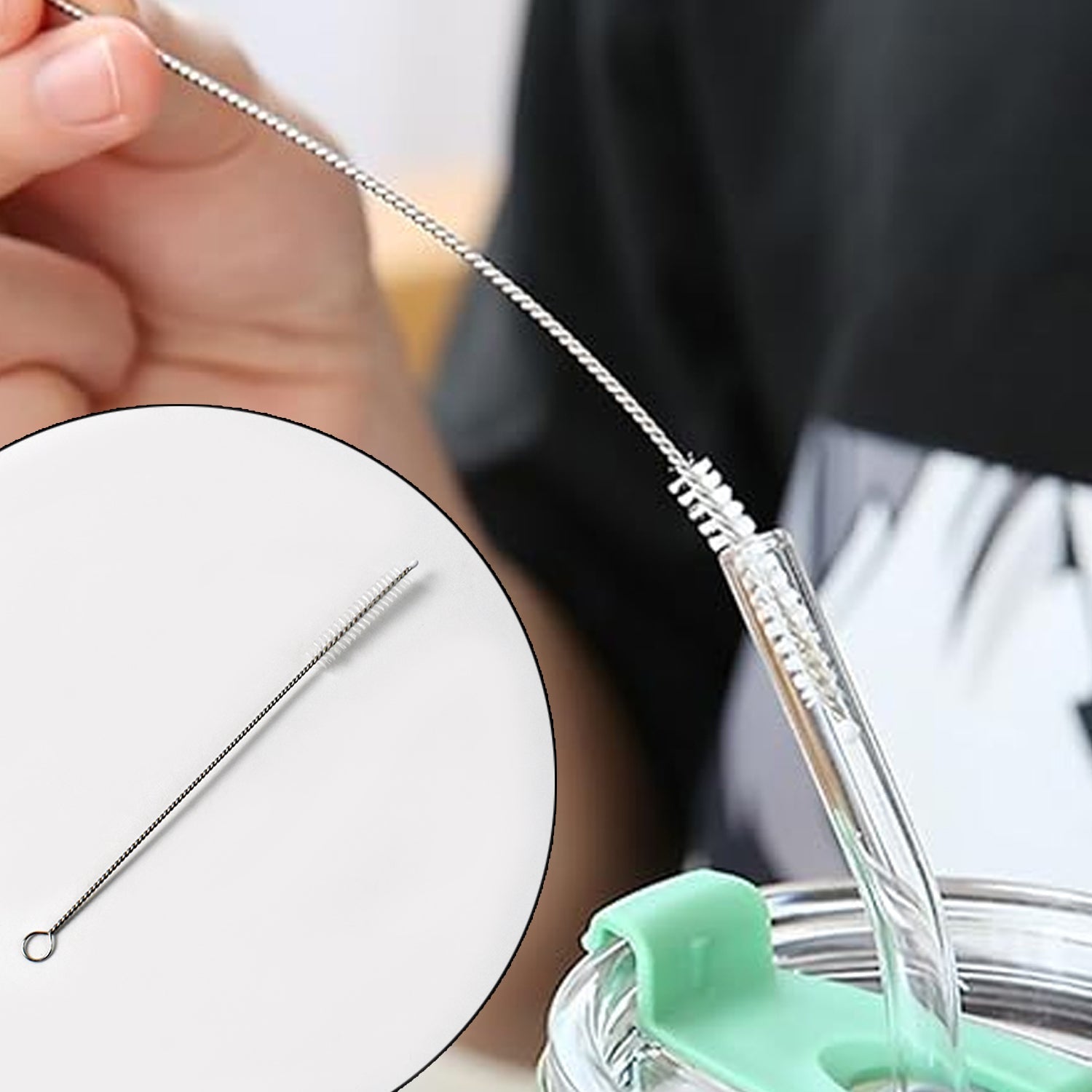 Hand holding straw cleaning brush ready to clean reusable straws