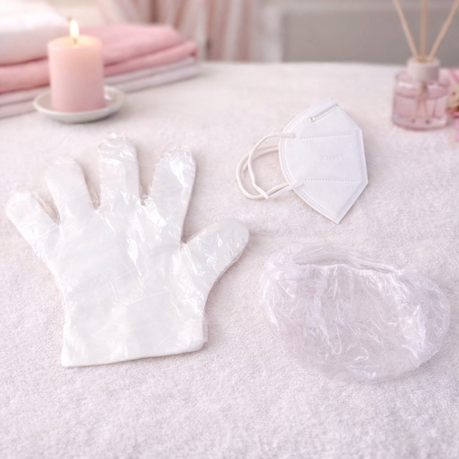 Disposable hygiene safety kit set including gloves, face mask, and shower cap in protective packaging