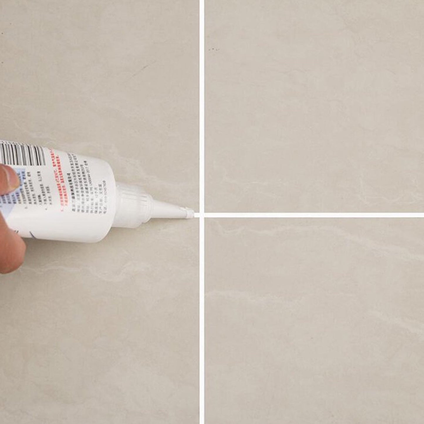 Freshly sealed tiled floor showing clean grout lines after application of the gap filler.
