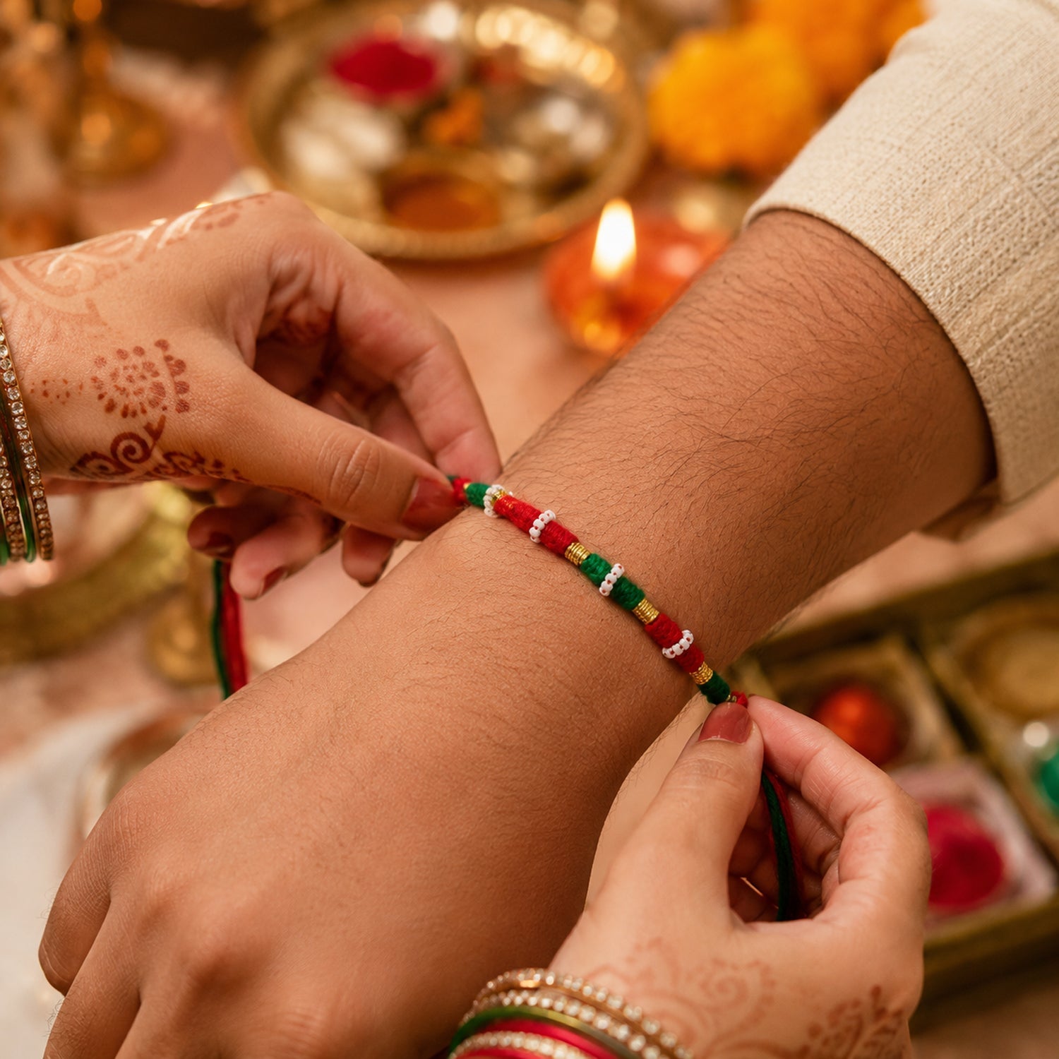 Traditional tricolor rakhi with pearl and golden bead accents