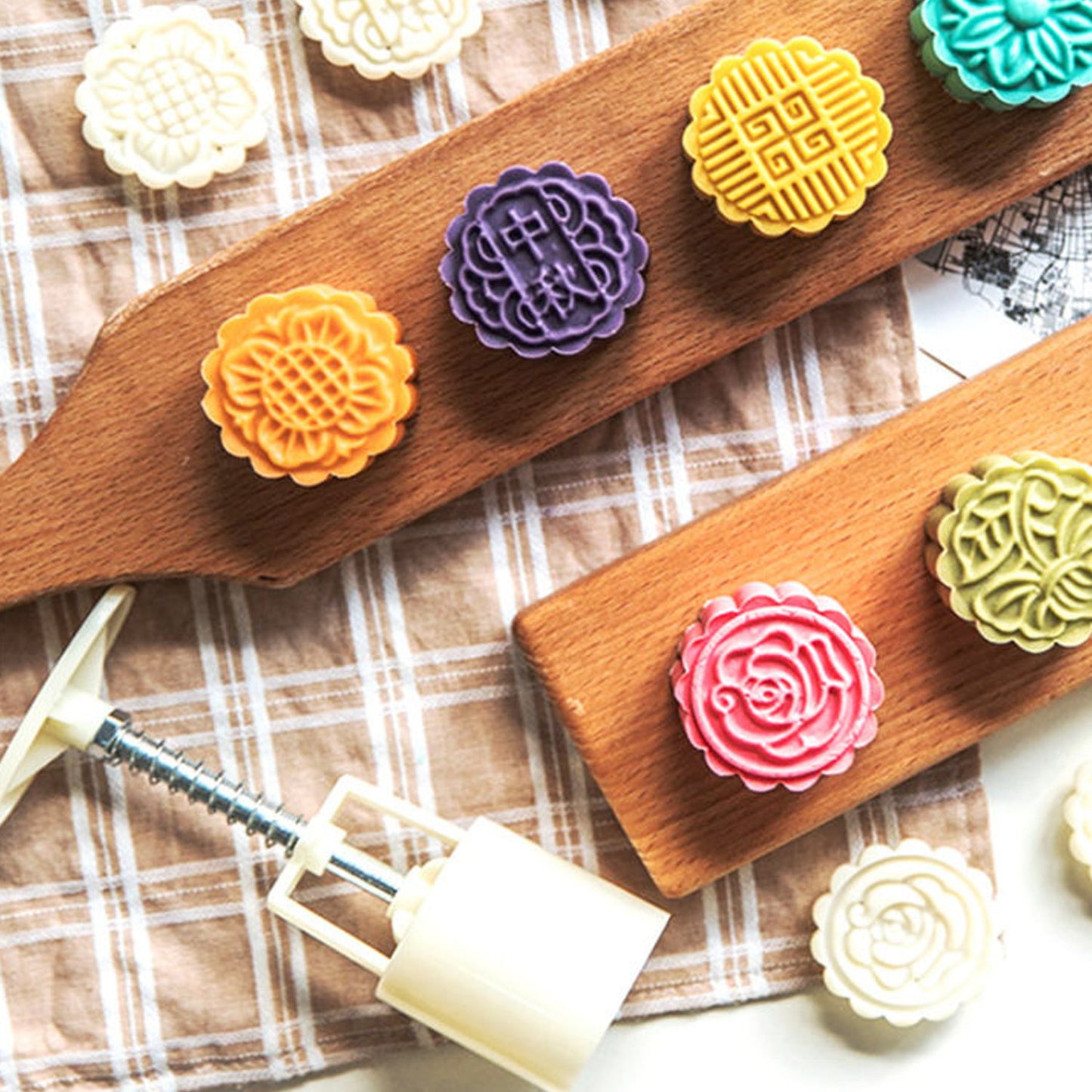Mooncake Press Mold kit showing 4 interchangeable floral stamps for detailed baking